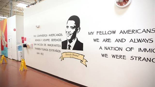 The mural of President Barack Obama in the Casa Padre immigrant shelter in Brownsville, located in a store that was previously a Walmart.